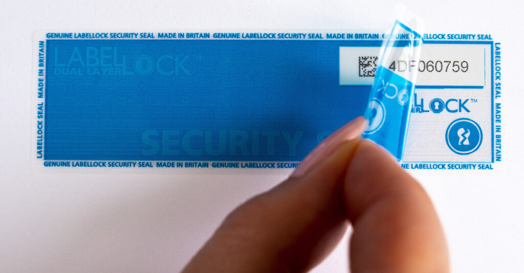 Dual Layer LabelLock® Label starting to be peeled off