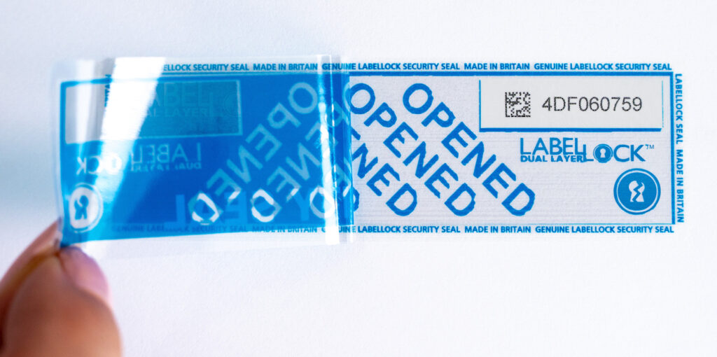 Dual Layer LabelLock® Label being peeled off - half way