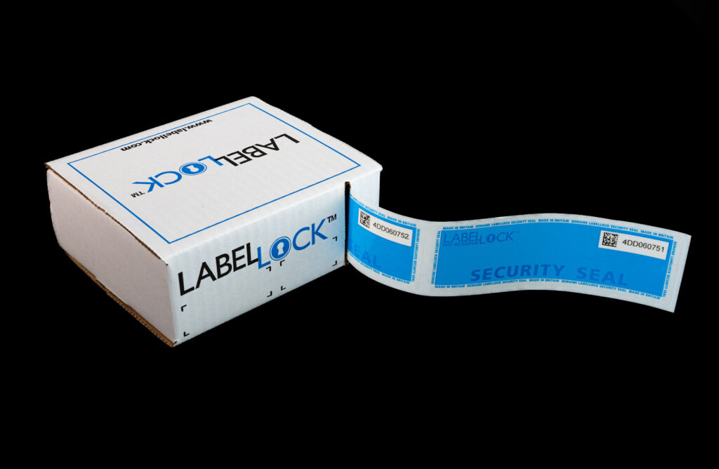 Large No Residue LabelLock® labels being reeled out of a LabelLock® Dispenser Box