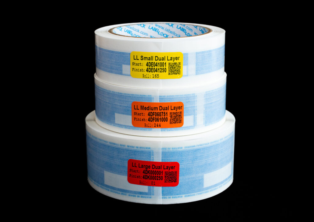 Stack of 3 reels of Dual Layer LabelLock® labels