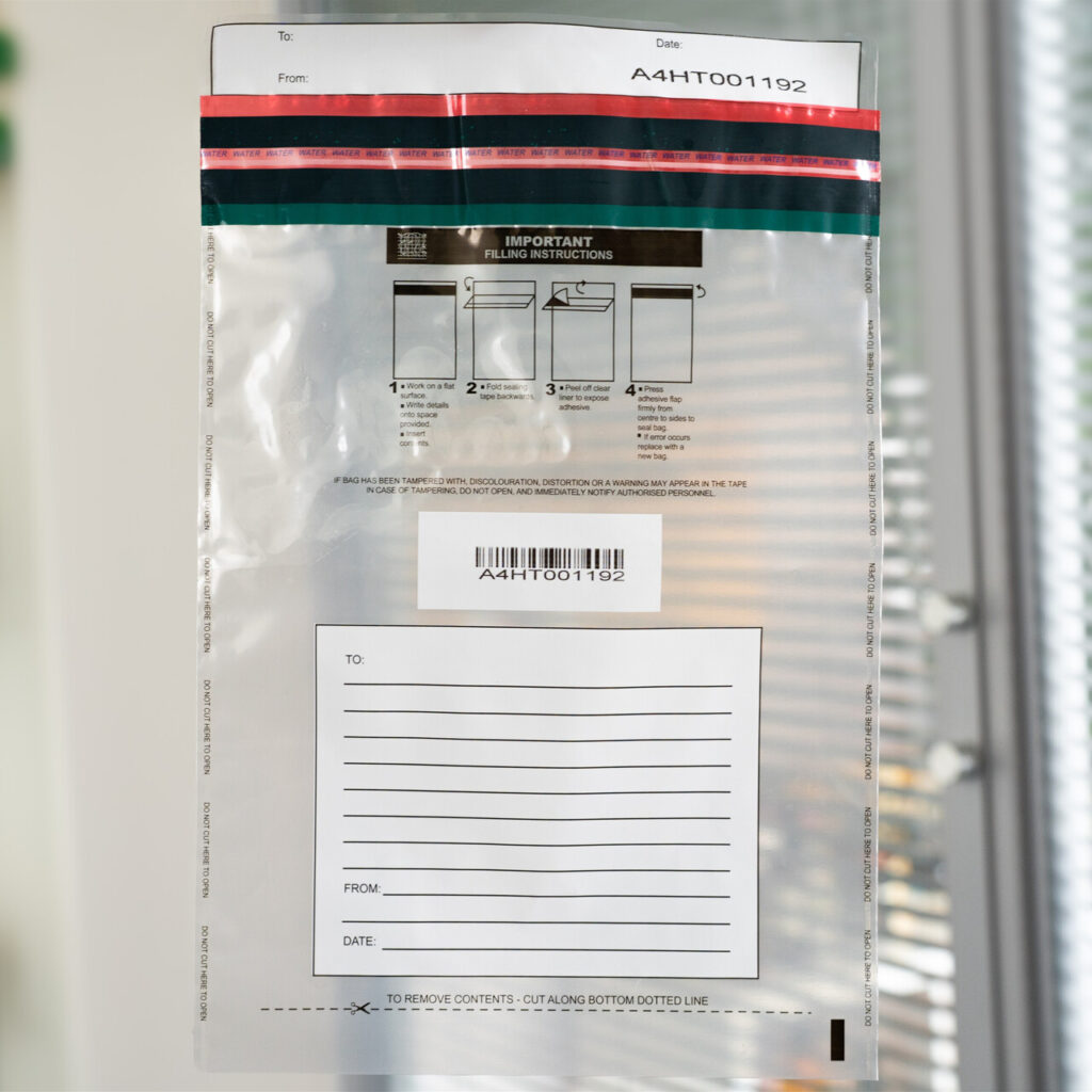 A Clear LabelLock® Security Envelope showing unique numbering and a barcode as well as an area with a white printed background to write instructions or information relating to the contents.