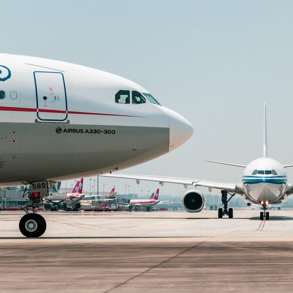 Multiple Aircraft sat on the apron at an airport