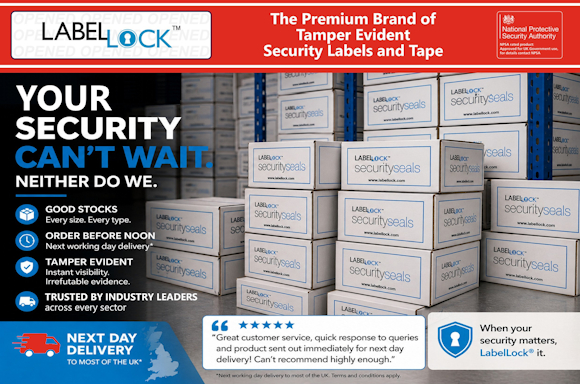 Promotional image for LabelLock® tamper-evident security labels and tape. The top red banner reads “The Premium Brand of Tamper Evident Security Labels and Tape” alongside the LabelLock® logo and an approval badge from the UK National Protective Security Authority. The main image shows stacks of white “security seals” boxes in a warehouse. Large text on the left says “YOUR SECURITY CAN’T WAIT. NEITHER DO WE.” Feature icons highlight good stock availability, next working day delivery, tamper-evident protection, and trusted use across industries. A blue banner at the bottom advertises next day delivery across most of the UK. A customer testimonial with five stars praises the company’s quick response and fast shipping. A shield icon and closing slogan read: “When your security matters, LabelLock® it.”