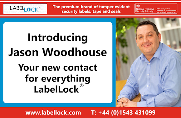 Promotional image for LabelLock®, introducing Jason Woodhouse as the new contact for all LabelLock® enquiries. The left side features the text: "Introducing Jason Woodhouse – Your new contact for everything LabelLock®". The right side shows a smiling man in a light blue shirt seated indoors. A red banner across the top reads: "The premium brand of tamper evident security labels, tape and seals", alongside the National Protective Security Authority (NPSA) logo. The footer displays the LabelLock® website (www.labellock.com) and telephone number +44 (0)1543 431099.